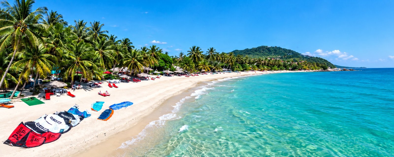 Ban Tai Beach on Koh Phangan, with palms and shallow water