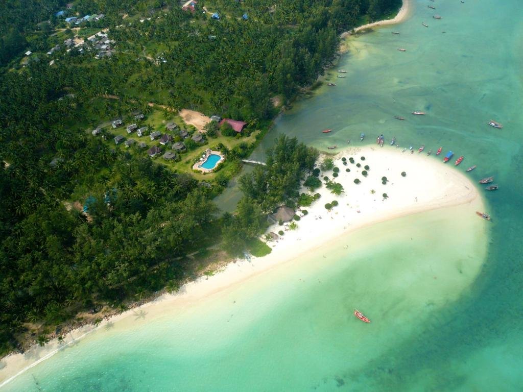 Aerial view of Chaloklum Bay, Koh Phangan, with a white-sand shoreline and turquoise water